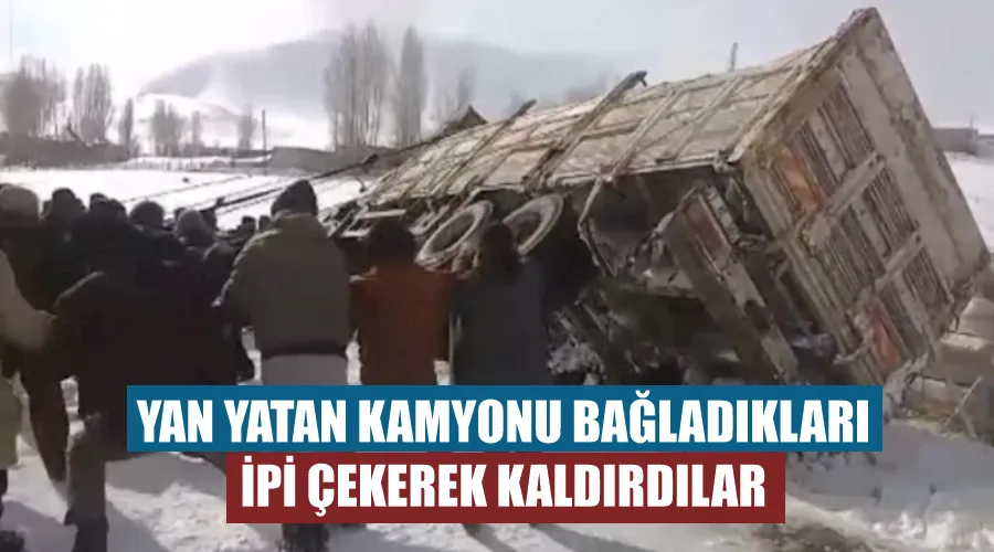 Yan yatan kamyonu bağladıkları ipi çekerek kaldırdılar