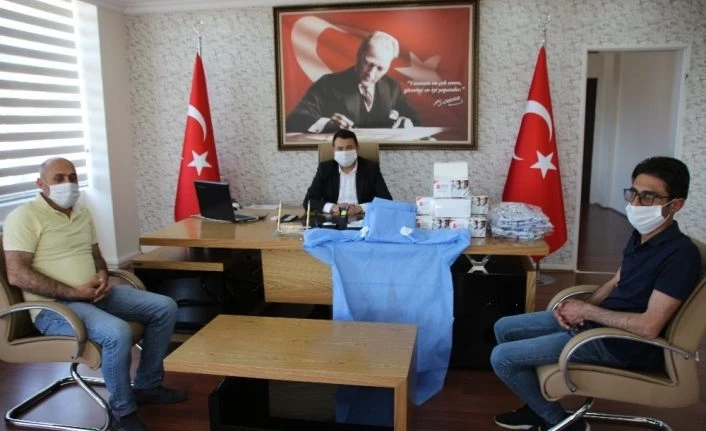 Varto Belediyesine tulum ve maske desteği